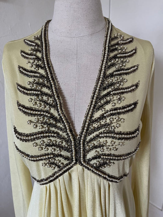 1970's Beaded Yellow Dress on mannequin close up