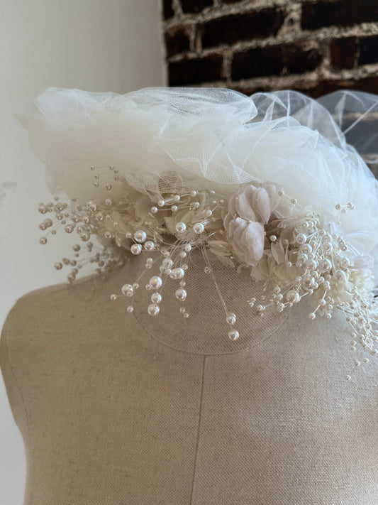 1980's Flower Crown with Tulle Puffs on a manakin.