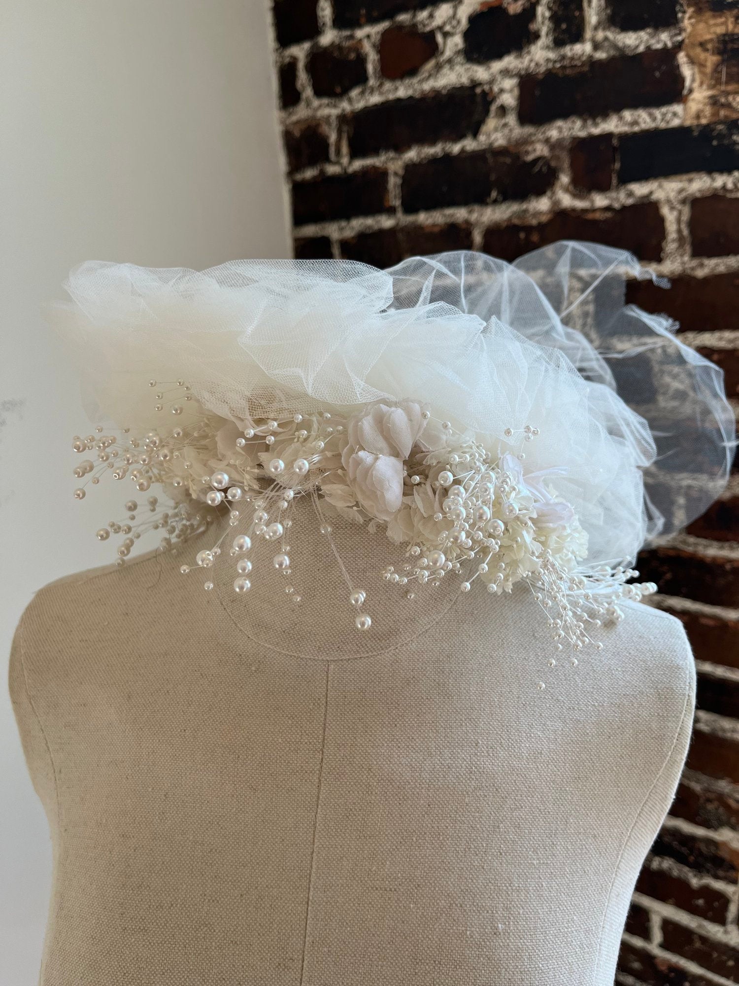 1980's Flower Crown with Tulle Puffs on a manakin.