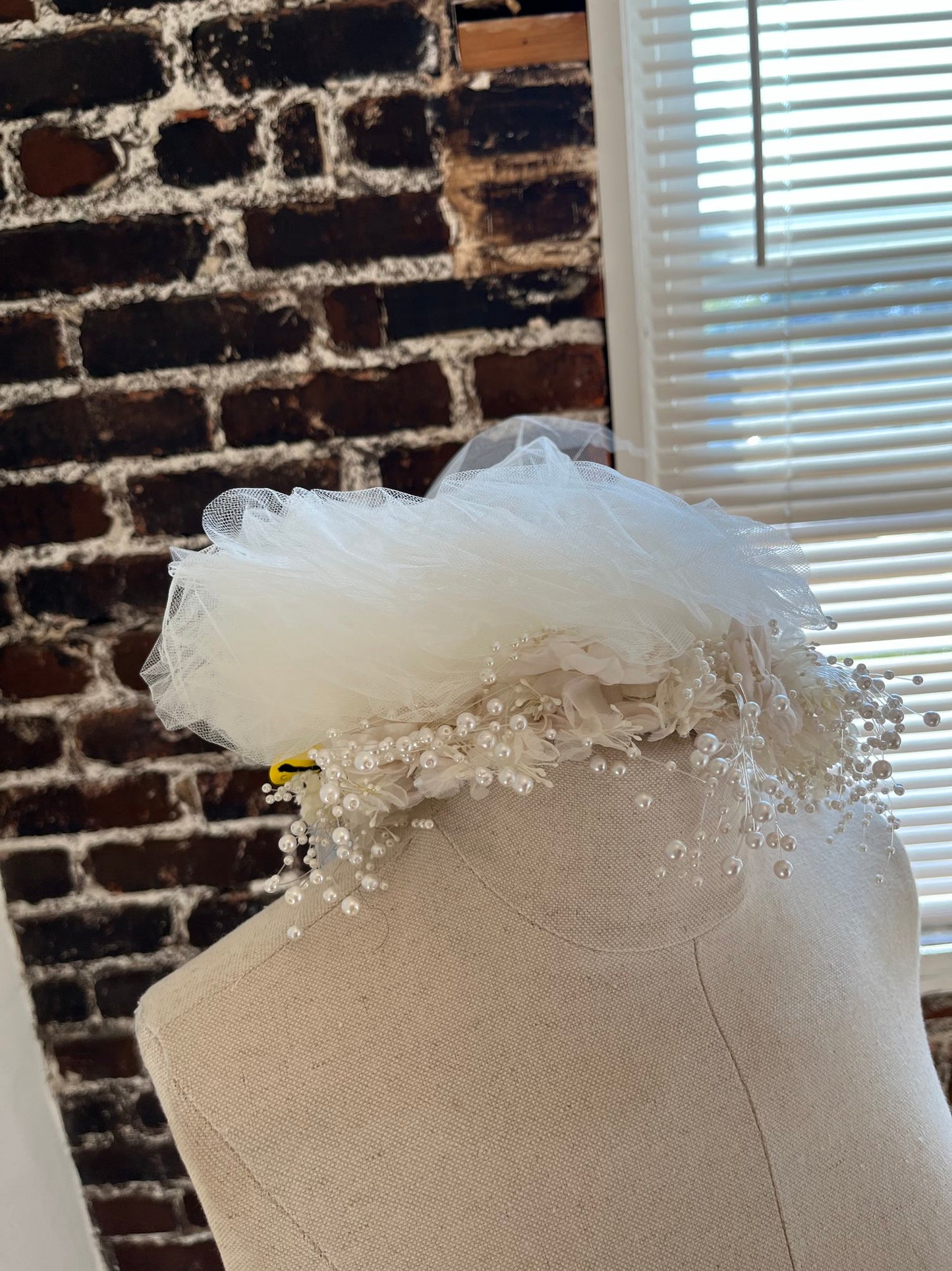 1980's Flower Crown with Tulle Puffs on a manakin.